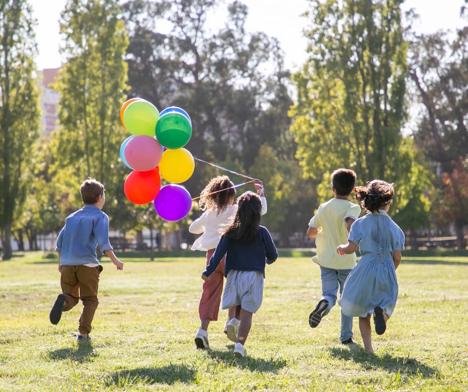 group of children playing with balloons